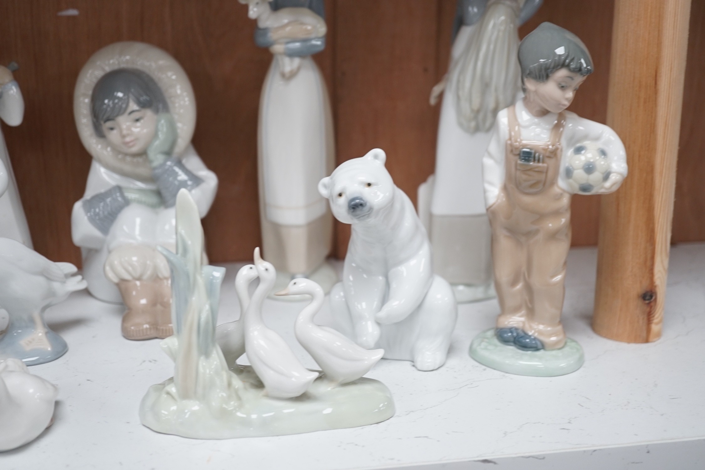 Lladro figurines, models of ducks and six Nao figurines and ducks and an unmarked model of ducks